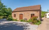 Headford Farm cottage is a very spacious barn conversion on a friendly working farm. The courtyard garden is at the back, and the two paddocks for you to use are to the left. - Thumbnail Image