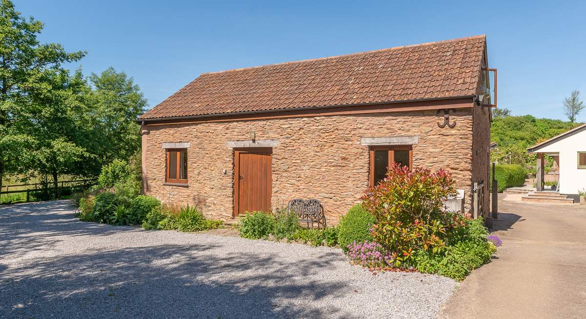 Headford Farm cottage is a very spacious barn conversion on a friendly working farm. The courtyard garden is at the back, and the two paddocks for you to use are to the left.