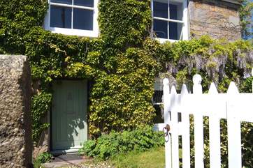 Open the gate, through the front garden and enter Montaza.