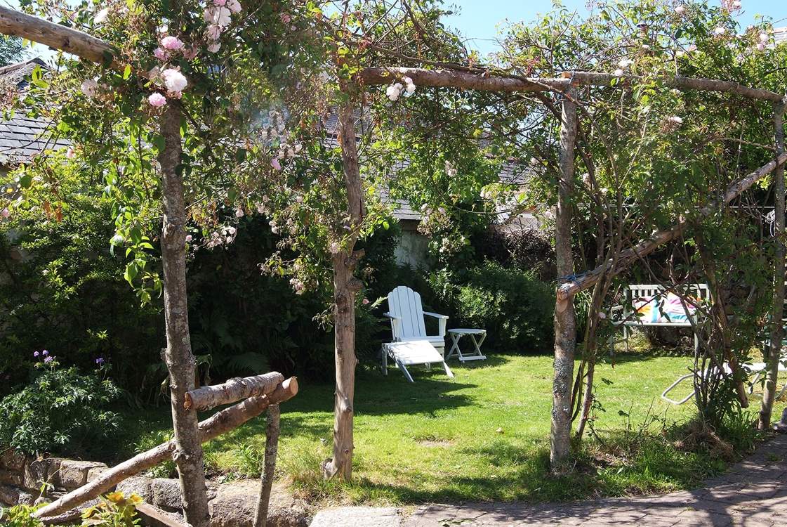 The sweet back garden, which is fully enclosed for your canine friends, private parking is just beside the entrance.
