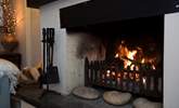 Relax by the roaring open fire. - Thumbnail Image