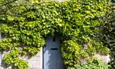 Such a charming entrance to this cottage, set back from the road. There is additional parking outside of the house if needed. - Thumbnail Image