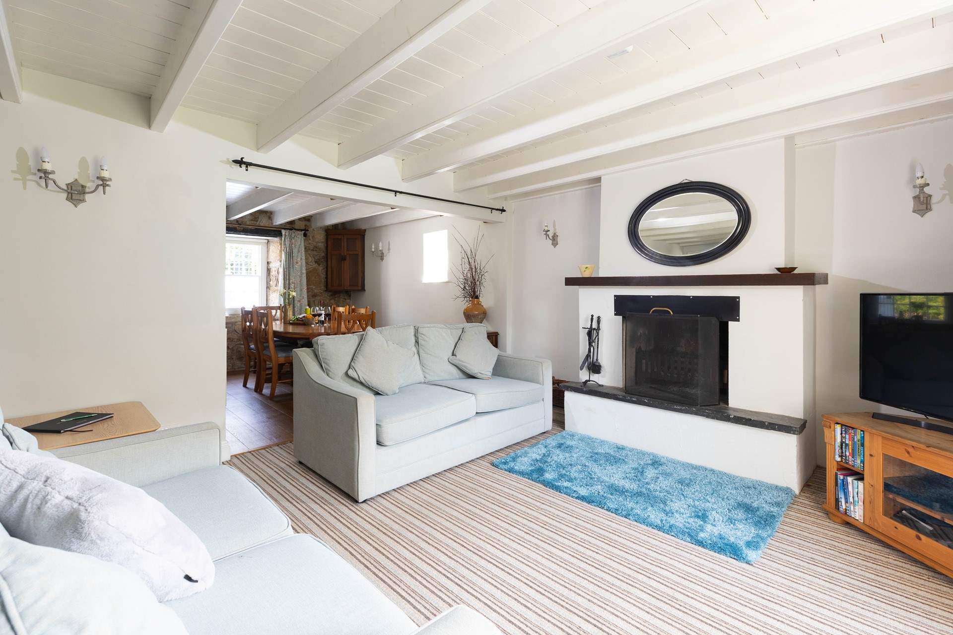 The dining area leads off the spacious sitting-room.