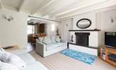 The dining area leads off the spacious sitting-room. - Thumbnail Image