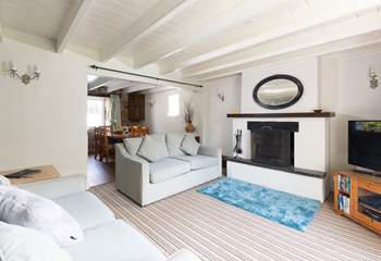 The dining area leads off the spacious sitting-room.