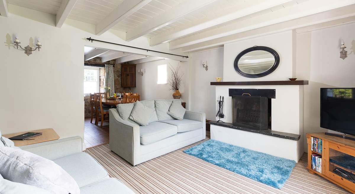 The dining area leads off the spacious sitting-room.