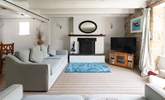 A spacious sitting-room with an open fire. - Thumbnail Image