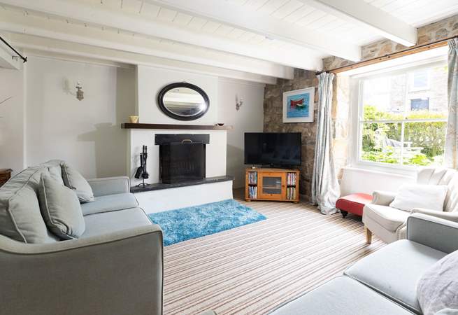 The huge original sash windows fill the rooms with light, the sitting-room has views of the charming front garden.