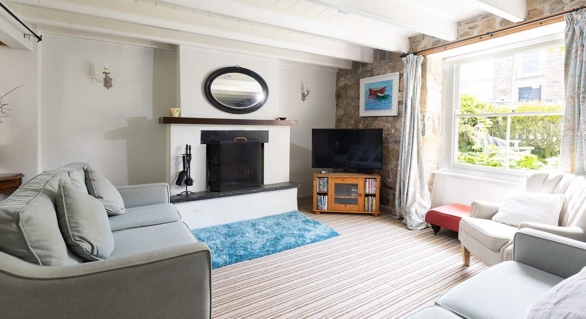 The huge original sash windows fill the rooms with light, the sitting-room has views of the charming front garden.