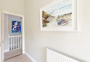 The owners original artwork is shown throughout this lovely cottage.