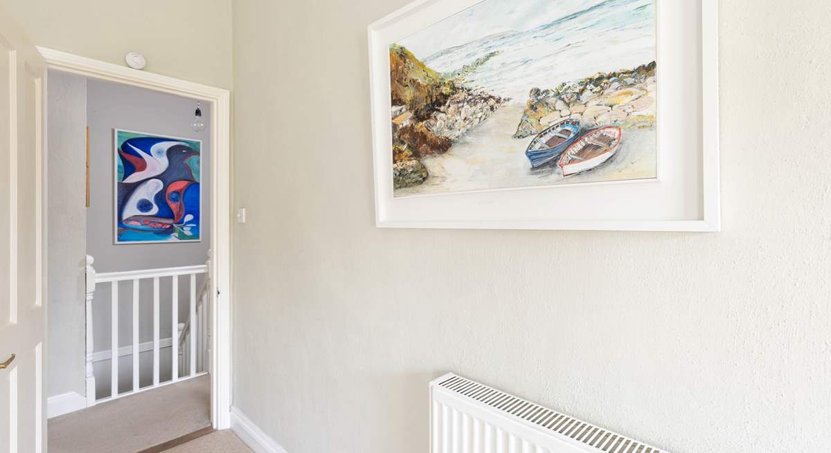The owners original artwork is shown throughout this lovely cottage.