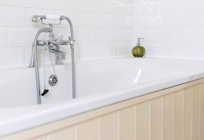 Wash away the sandy day in the huge bath.