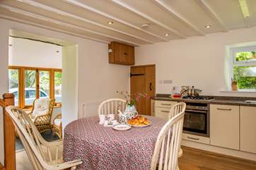 The light and bright eat-in kitchen.