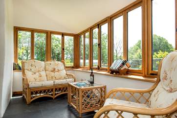 Enjoy relaxing in the sun-room watching the birds.