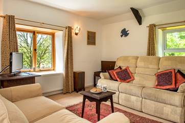 The sitting-room on the first floor overlooks the grounds.