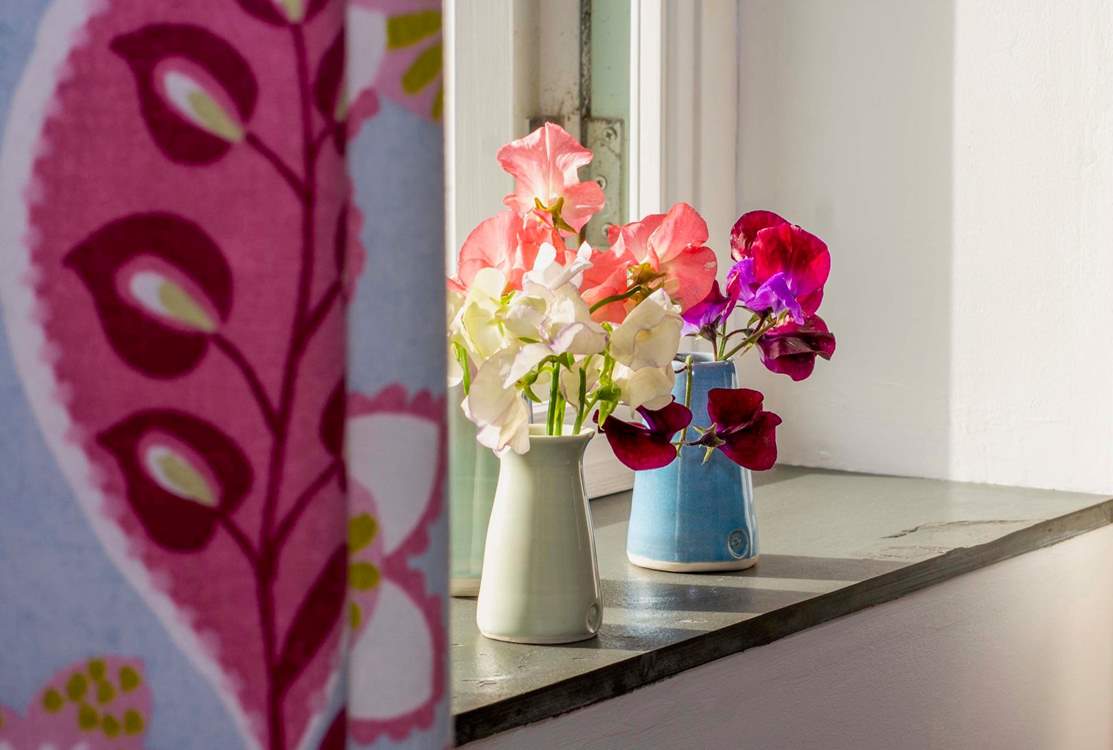 Fresh flowers for every guest, often from the owners' garden.