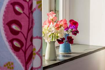Fresh flowers for every guest, often from the owners' garden.