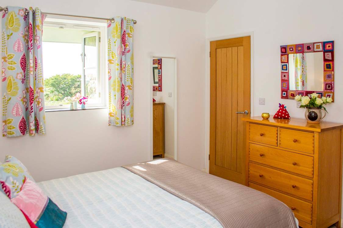 The bedroom with comfy king-size bed and crisp cotton sheets.