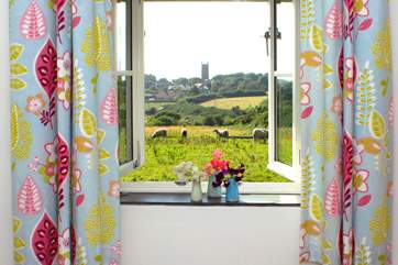 This is the view from your bedroom window across the fields to the village church.