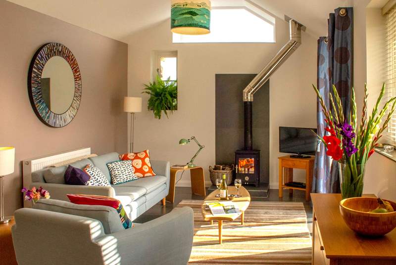 In the cooler months snuggle up on the sofa and get cosy around the glow of the wood-burner.