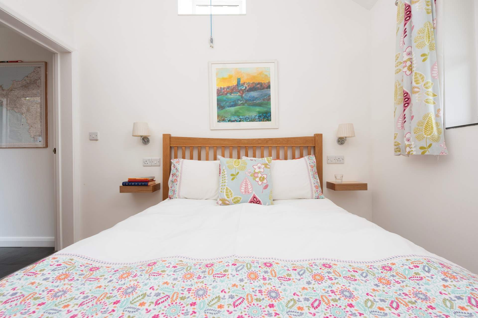 The beautifully furnished bedroom complete with wonderful countryside views.