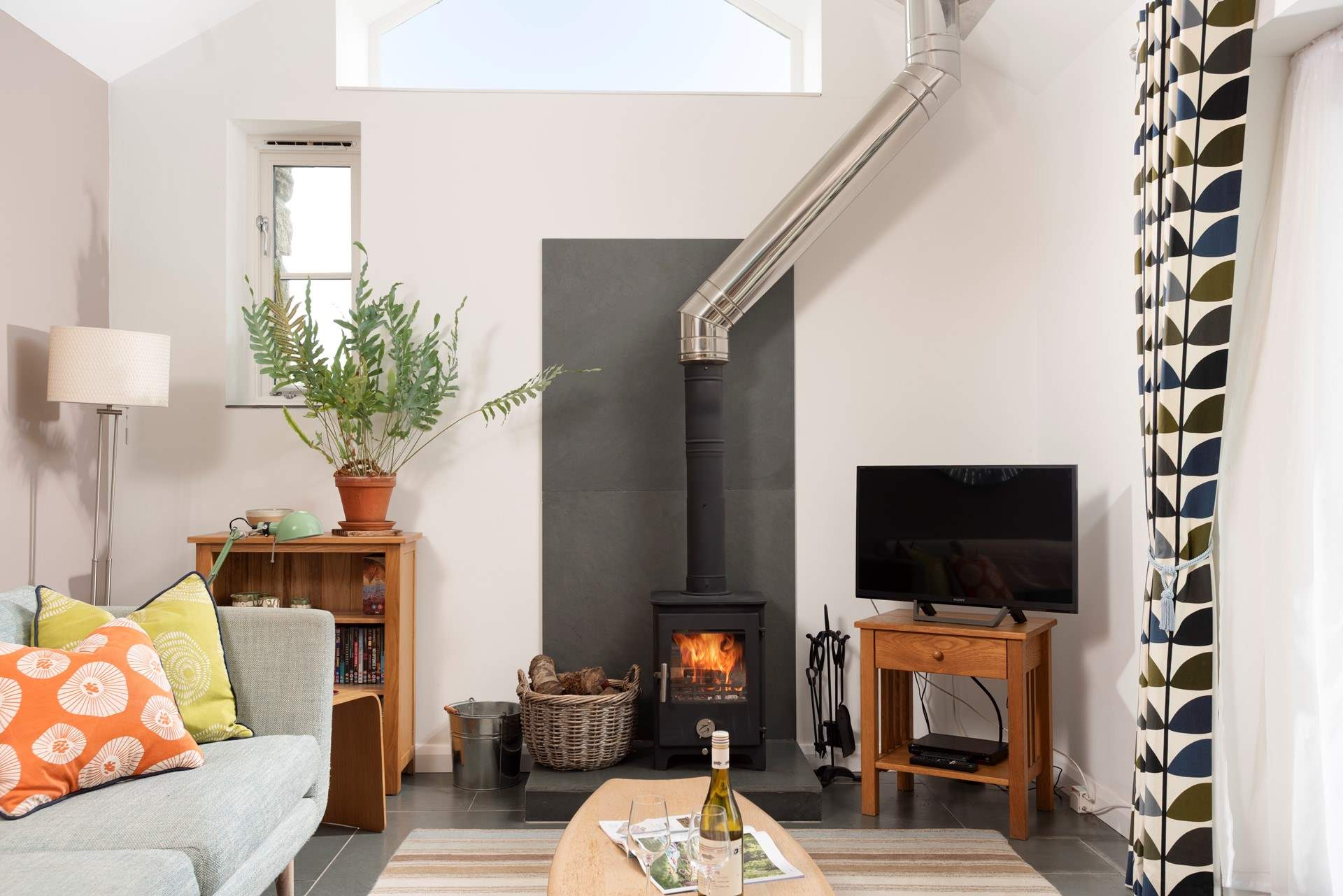 Light the wood burner on cooler evenings.