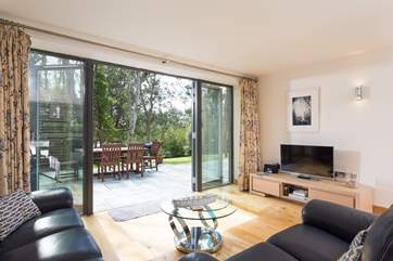 Looking out to the dining terrace and hot tub.