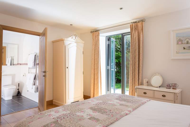 Bedroom 1 has French doors out to the terrace.
