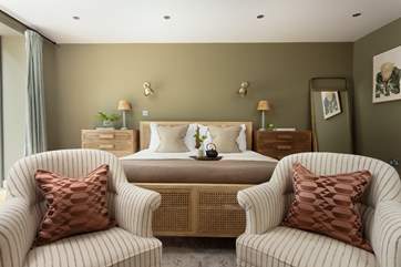The bedroom with en suite shower-room has a wonderfully-comfy super-king bed swathed in beautiful bedding - the perfect spot for breakfast in bed.