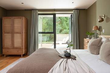 On warmer days, open the patio doors to welcome a gentle breeze through the linen drapes and invite the outside in.