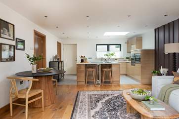 Uncover ample space for prepping your chosen dish with local treats, plus a lovely island with oak stools rests between the kitchen and lounge area, perfect for informal dining.