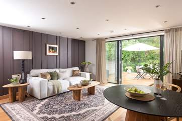 Welcome to Cedar! Inside this sweet escape you'll find an open plan kitchen and living space, adorned in a soft palette of pastel hues and rustic interior touches.