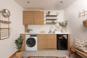 Open up the front door and step into the beautiful entrance hall that has a washing machine and freezer too.