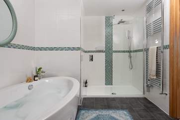 You have a fabulous walk in shower too!