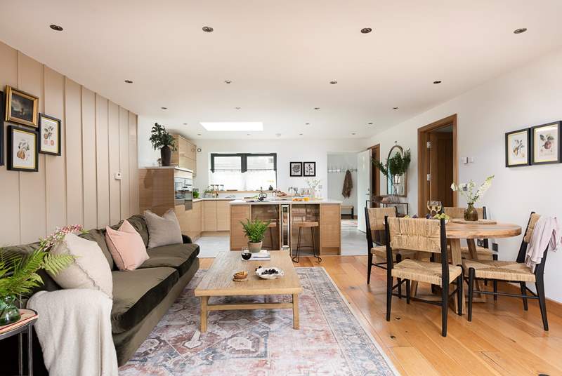 Uncover ample space for prepping your chosen dish with local treats, plus a lovely island with oak stools rests between the kitchen and lounge area, perfect for informal dining.