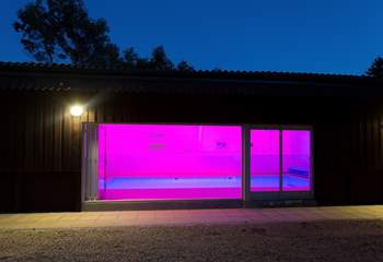 The pool-house is just beyond the orchard and looks fabulous lit up at night.