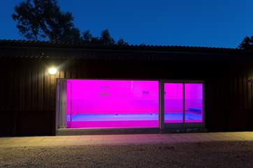 The pool-house is just beyond the orchard and looks fabulous lit up at night.
