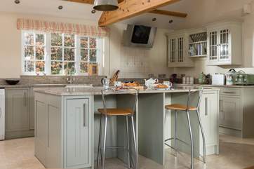 The island incorporates a breakfast-bar.