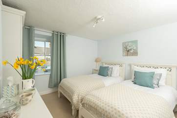 The twin bedroom is the first bedroom at the top of the stairs.