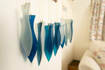Colourful seaside theme decorations ensure a welcoming holiday feel to the cottage