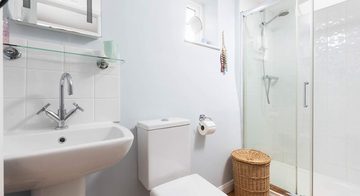 The family bathroom on the first floor has a large shower, perfect after a day on the beach.