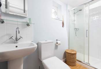 The family bathroom on the first floor has a large walk-in shower, perfect after a day on the beach.