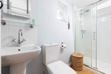 The family bathroom on the first floor has a large walk-in shower, perfect after a day on the beach.