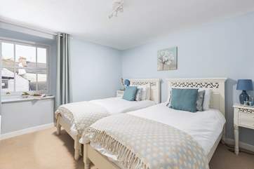 The dreamy twin bedroom is the first bedroom at the top of the stairs.
