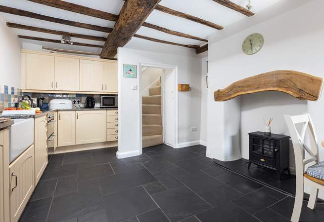 The slate floor of the kitchen/dining-room adds to the traditional feel but is also great for dogs after a walk along the beach.