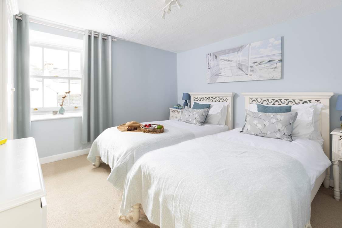 The dreamy twin bedroom is the first bedroom at the top of the stairs.