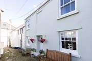 Set in a pretty cobbled courtyard, Poachers Cottage is a delight.
