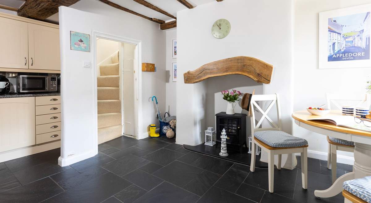 The slate floor of the kitchen/dining-room adds to the traditional feel but is also great for dogs after a walk along the beach.