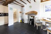 The slate floor of the kitchen/dining-room adds to the traditional feel but is also great for dogs after a walk along the beach.