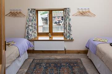 This is the second twin room at the top of the stairs, where you can watch the cows across the yard.